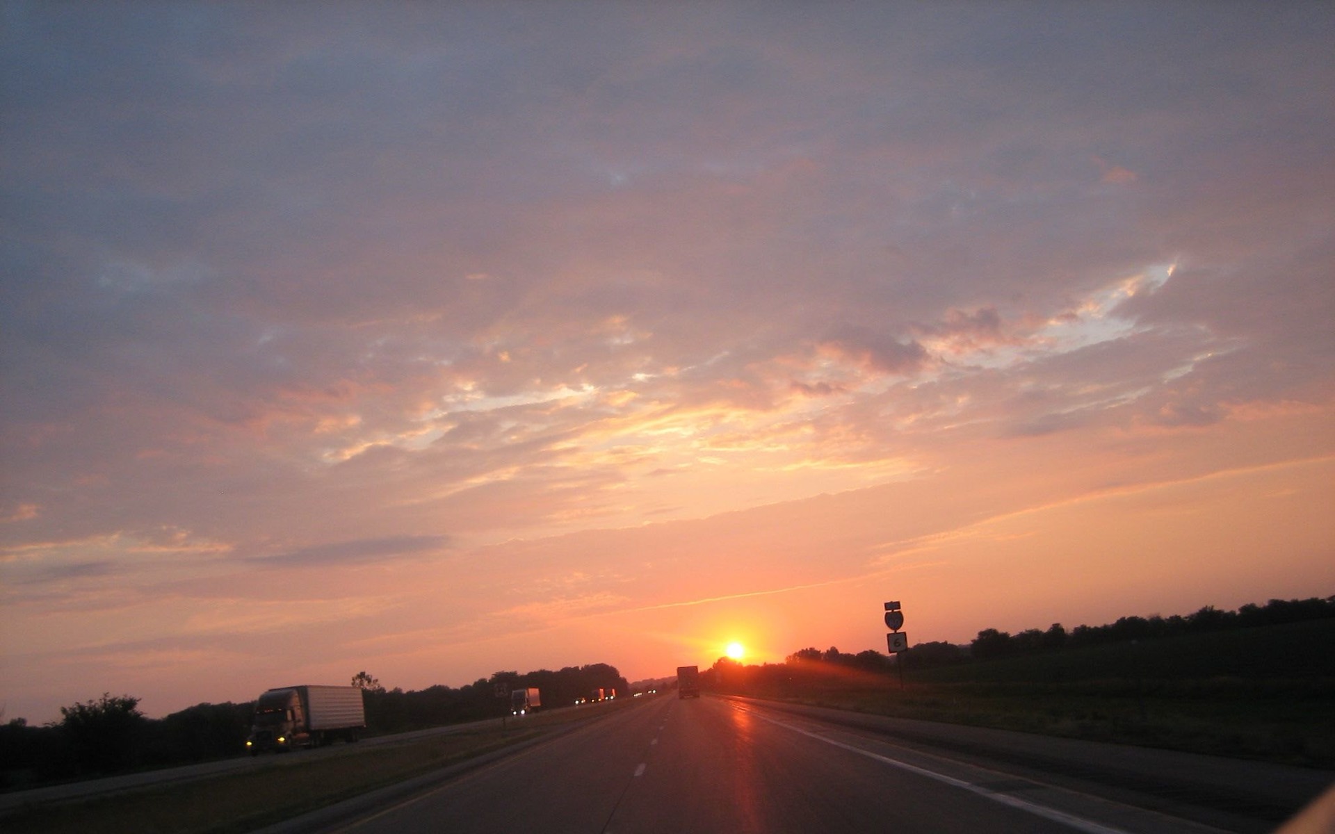 AI in logistics and transportation &mdash; a semi truck hauling freight on Interstate 80 at dusk